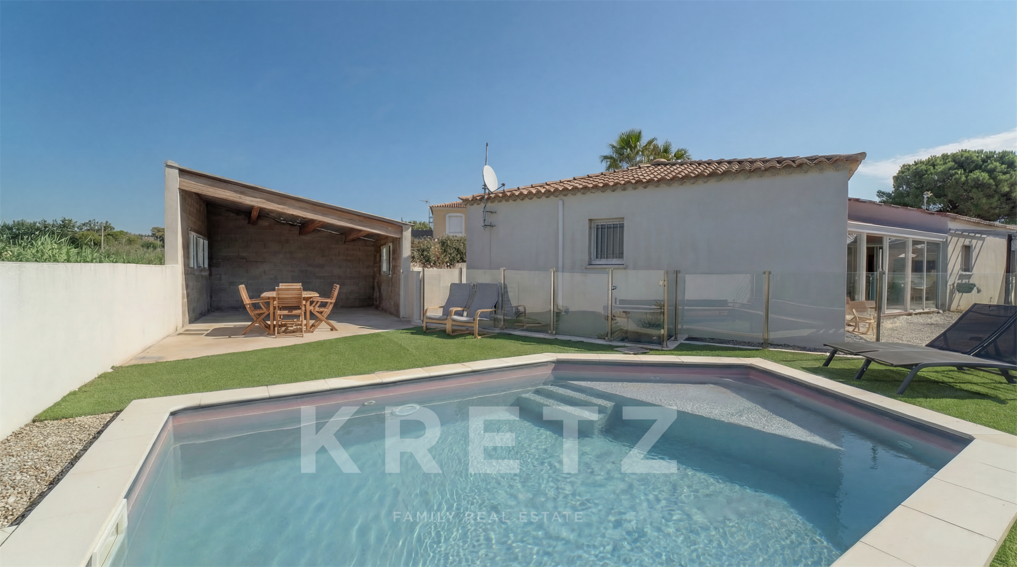 contemporary house with an outbuilding
